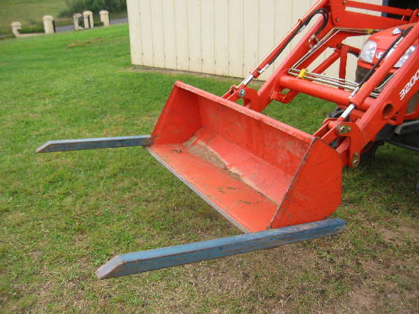 My kubota with bucket forks attached to the fel