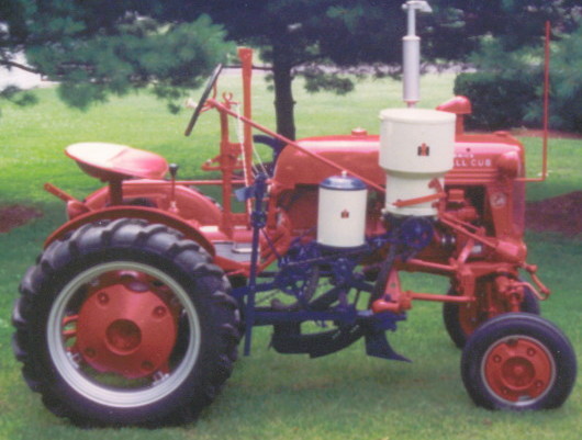 My fathers 1953 Farmall cub bought new. I restored the cub in 1998 and now take it to many shows. I have many rare parts for it. Here it has a corn planter and sidedresser on it.  