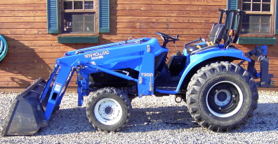 2002 New Holland TC33D with a 7308 loader and quick hitch.