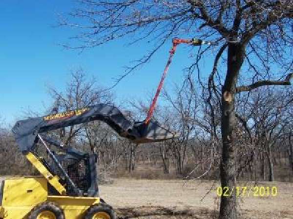 New Holland trimming trees with Limbinator Saw