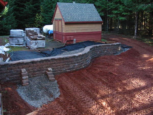 Shed and retaining wall
