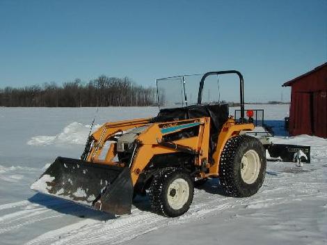 Cub Cadet 7275 with 417 loader, 60 inch  bucket and turf tires. TSC windbreaker cab.